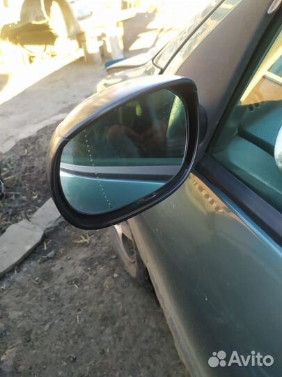 Зеркало левое Peugeot 206