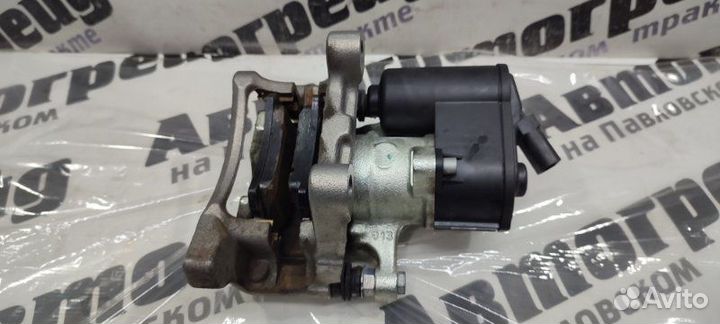 Суппорт тормозной задний левый Volkswagen Passat