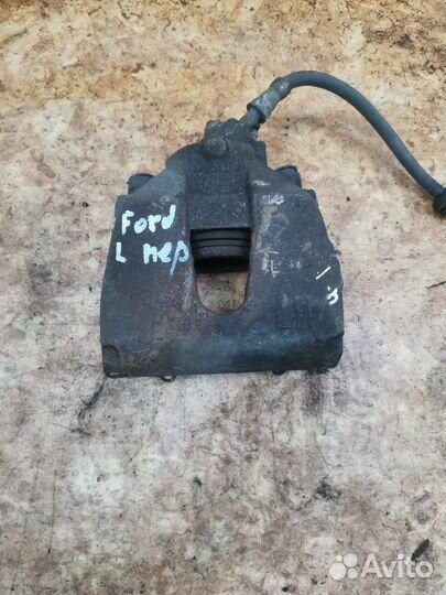 Суппорт тормозной передний левый Ford Focus 2