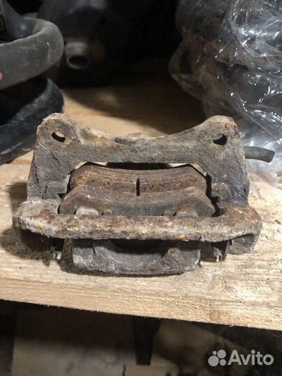 Суппорт тормозной задний левый Chevrolet Lacetti