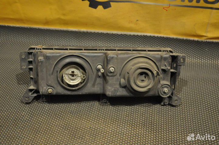 Фара левая Nissan Vanette C22 CA18ET