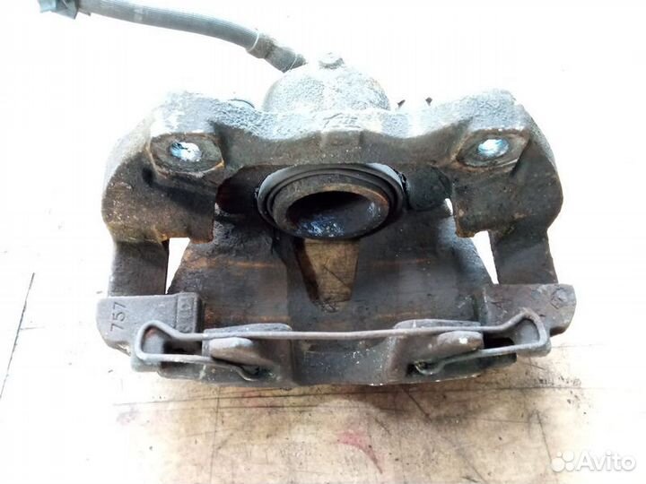 Суппорт тормозной передний левый Опель Зафира Б