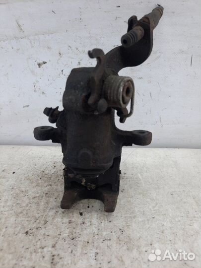 Суппорт тормозной задний левый Kia Cerato хэтчбэк