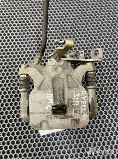 Суппорт задний правый Mazda 3 BM