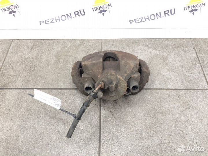 Суппорт тормозной передний левый Ford Focus