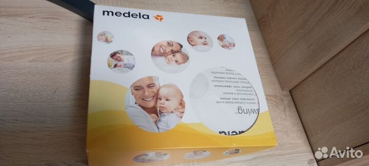 Эл. молокоотсос Medela swing с бутылками, сосками