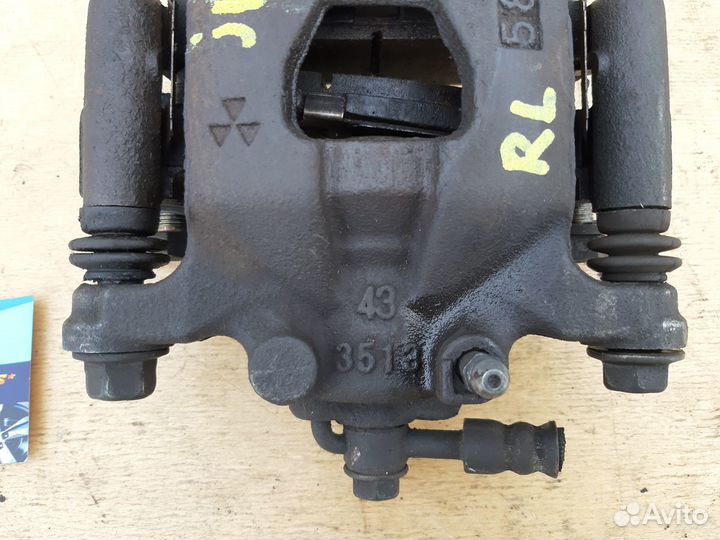 Суппорт тормозной задний левый Nissan Qashqai J10