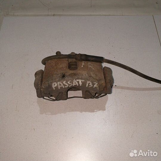 Суппорт тормозной передний Volkswagen Passat B7