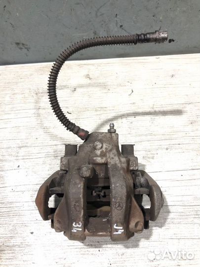 Суппорт тормозной задний левый Mercedes-Benz