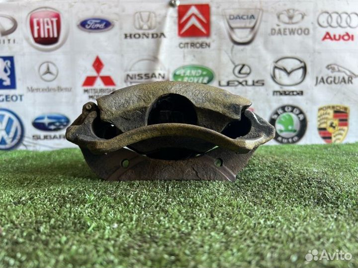 Суппорт тормозной передний левый Ford Escort 5