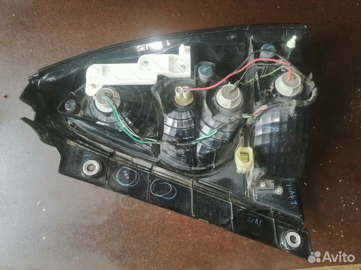 Фонарь задний левый Субару SG