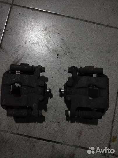 Суппорт тормозной задний Nissan Qashqai J10