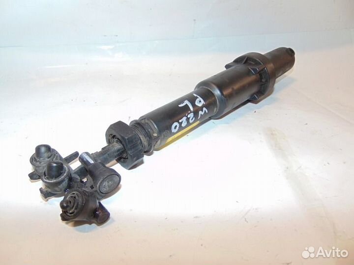 Форсунка омывателя фар левая