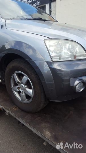 Суппорт тормозной задний левый Kia Sorento (2002