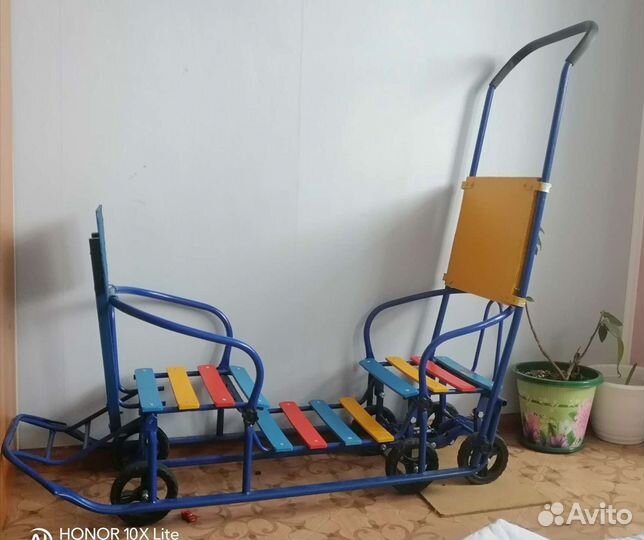 Детские санки на колёсиках для погодок