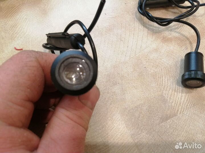 Проекция логотипа BMW глазок