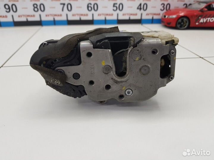 Замок двери задний левый (Opel Astra)