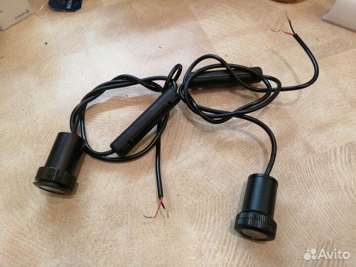 Проекция логотипа BMW глазок