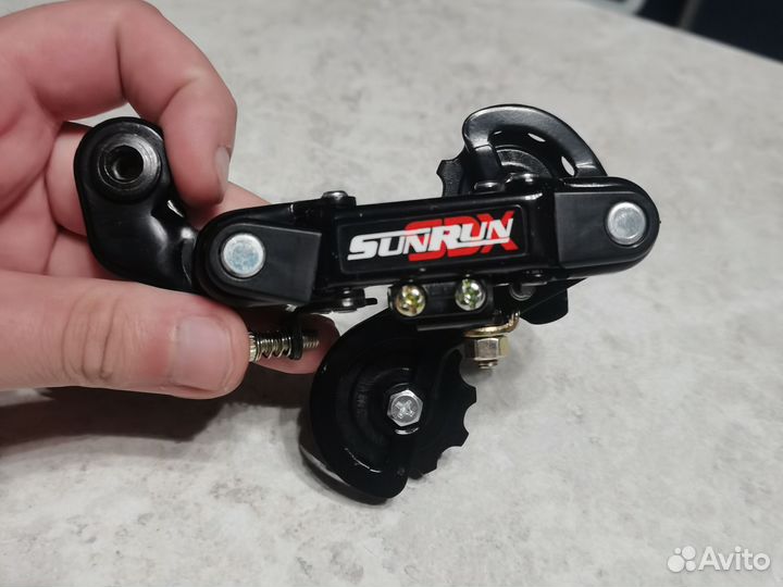 Задний переключатель скоростей на велосипед