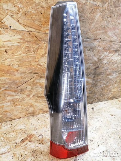 Фонарь левый Mitsubishi Grandis NA4W