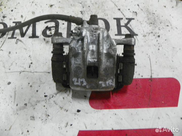 Суппорт тормозной задний правый Kia Sportage