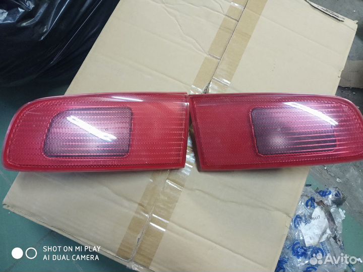 Стоп сигнал Мазда Демио. Фонарь Mazda Demio