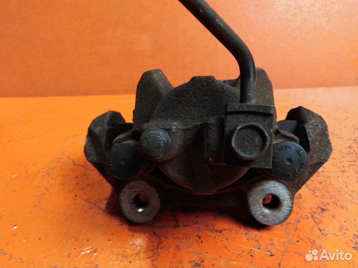 Суппорт тормозной задний левый Jeep Grand Cherokee