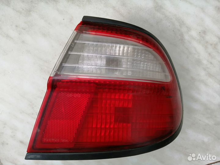 Задний правый фонарь Nissan Almera N15 оригинал