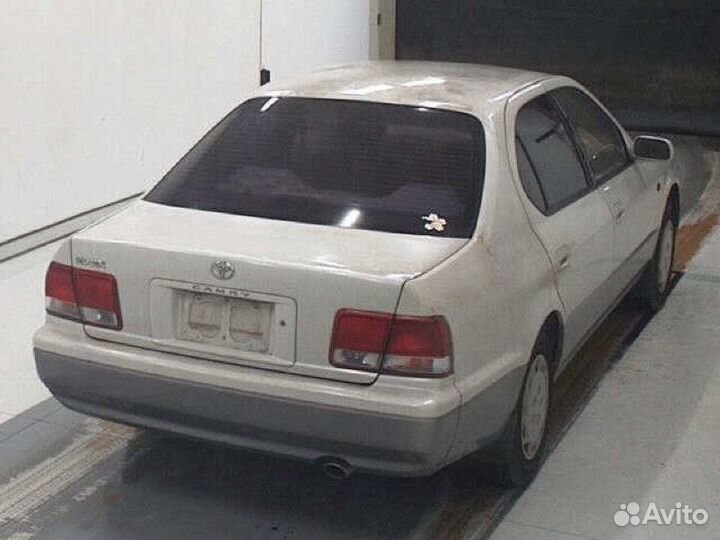 Суппорт тормозной передний левый Toyota Camry SV41