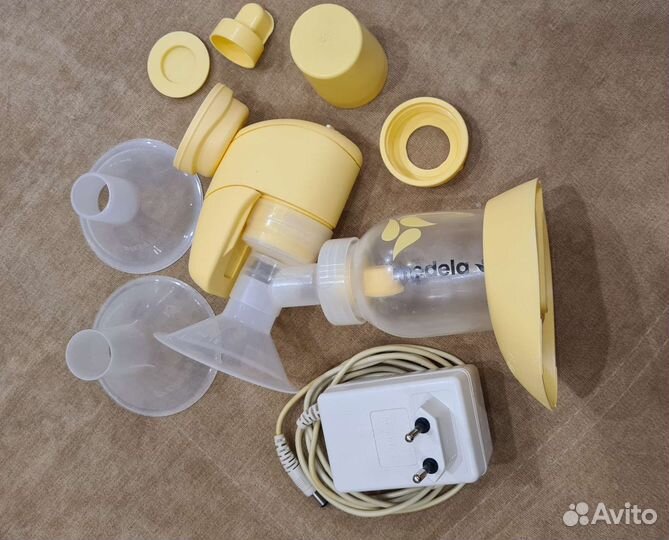 Молокоотсос medela и насадки новые