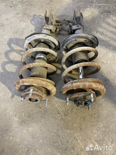 Стойки передние Митцубиси Лансер 10