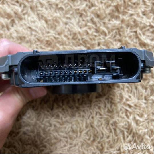 Блок управления фарами передний левый Toyota