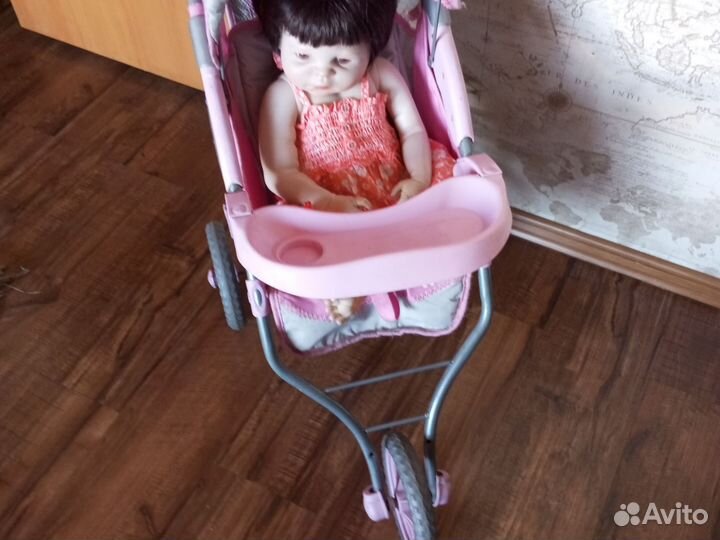 Кукла-реборн в коляске