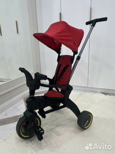 Детский велосипед с ручкой doona