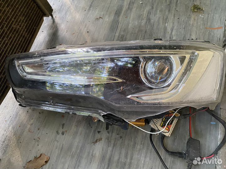 Фара левая lancer 10
