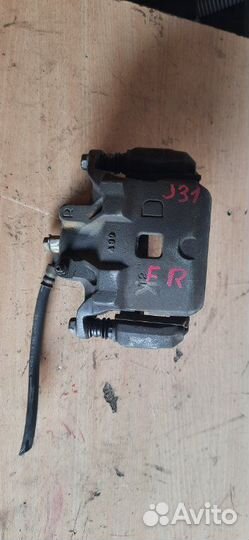 Суппорт тормозной передний правый Nissan Teana J31