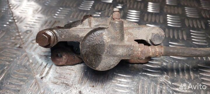 Суппорт тормозной передний левый Mitsubishi Lancer