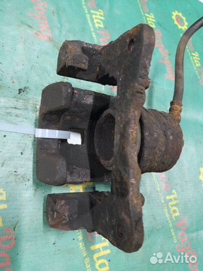 Суппорт передний левый Nissan Almera N15 хэтчбек