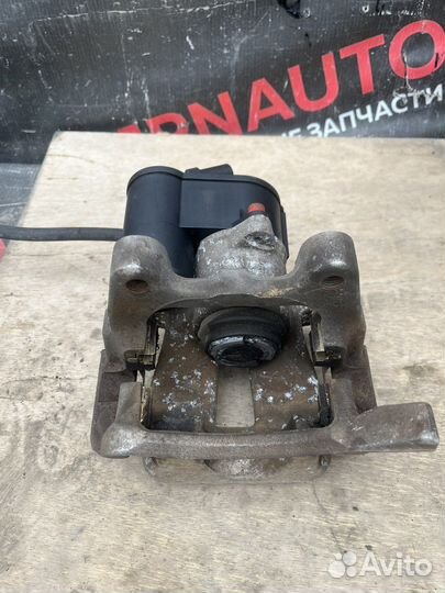 Суппорт задний левый Volkswagen Passat B6