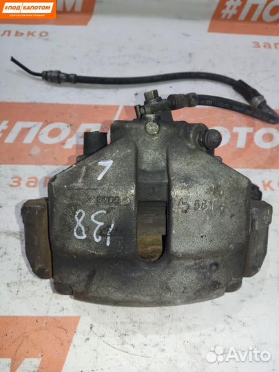 Суппорт тормозной передний левый Volkswagen Eos