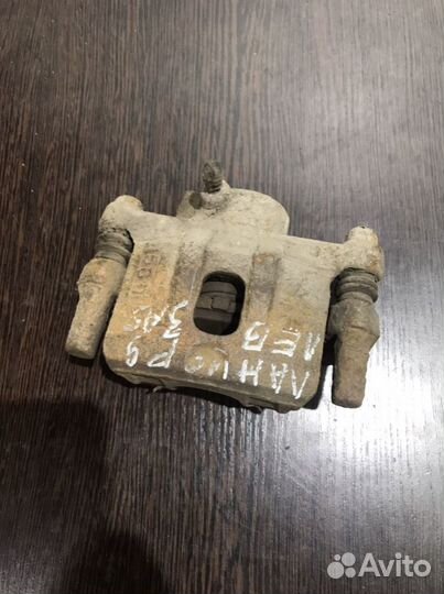 Суппорт задний левый Mitsubishi Lancer 9