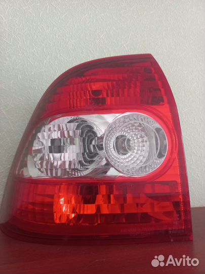 Фара левая задняя priora