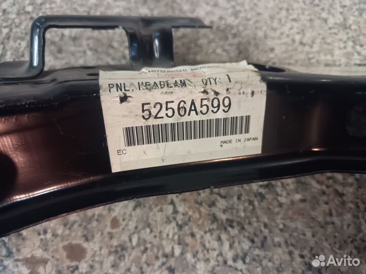 Панель кронштейна фары левая Митцубиси Лансер 10