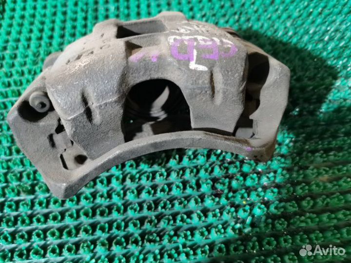 Суппорт тормозной передний левый Mitsubishi Lancer