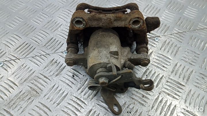 Суппорт тормозной задний левый Skoda Octavia