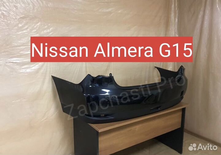 Задний бампер на Nissan Almera G15 чёрный 2012