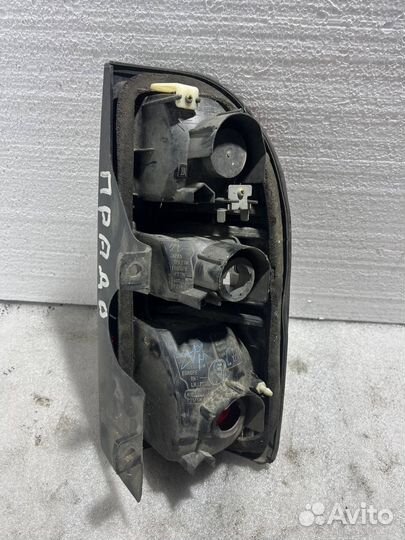 Фонарь заднего хода левый Toyota Land Cruiser 90 P