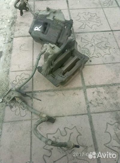 Супорт тормозной передний Ниссан примьера р12