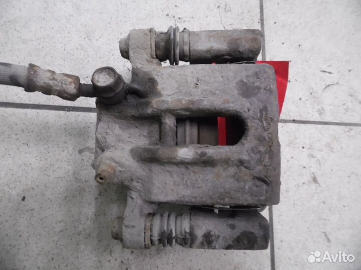 Суппорт тормозной задний правый Toyota Corolla E12