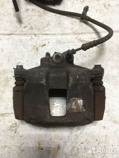 Суппорт тормозной передний левый Peugeot 207 EP6